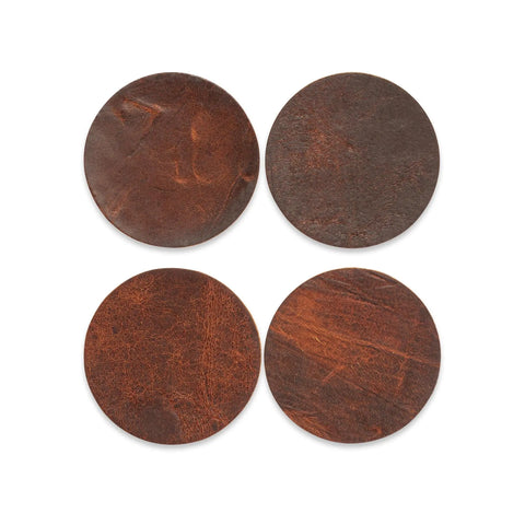The Moose Leather Coaster Set by Rogue Industries features four round, brown leather coasters with natural grain, arranged in a square on a white background. This premium set is proudly made in Maine.