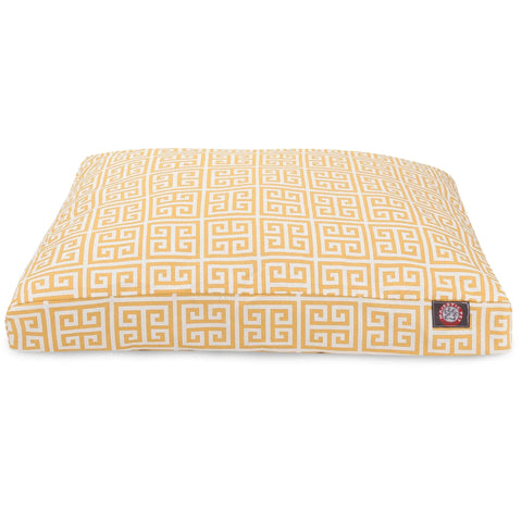 The Majestic Pet Towers Rectangle Dog Bed features a yellow and white Greek key pattern, a washable cover, and a small black and red logo tag on the side.