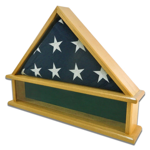 The Presidential Burial Flag Shadow Box - Oak by Legacies of America Woodworking Company displays a folded American flag behind real glass in a triangular oak case with a flat shelf below. Made in the USA.