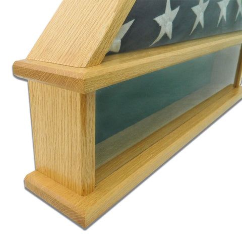 Close-up of The Presidential Burial Flag Shadow Box by Legacies of America Woodworking Company, crafted from Oak and made in the USA. Real glass front displays a folded American flag with white stars on blue visible inside.