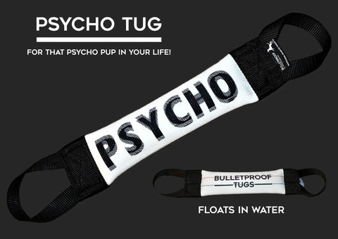 The Bulletproof Pet Products Inc Psycho (Optical Illusion) Fire Hose Training Tug is a durable black and white dog toy with handles on both ends, labeled PSYCHO. Text reads FOR THAT PSYCHO PUP IN YOUR LIFE! and it floats in water.