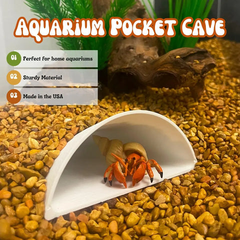 A hermit crab in a white, half-cylinder cave on gravel. Text: “REEFSHAPE Pocket Cave by Chatelet Manufacturing”—perfect for aquariums or terrariums, sturdy, minimalist shelter for fish, shrimp, reptiles & more. Made in USA.