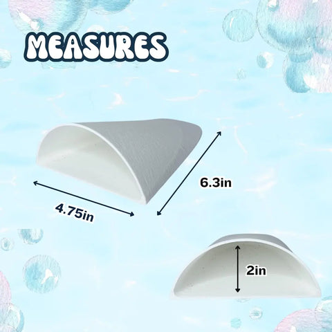 The REEFSHAPE Aquarium or Terrarium Pocket Cave by Chatelet Manufacturing is a white, semi-cylindrical hideout measuring 4.75 W x 6.3 L x 2 H, ideal for fish, shrimp, reptiles, and amphibians. MEASURES appears above a blue water-patterned background with bubbles.