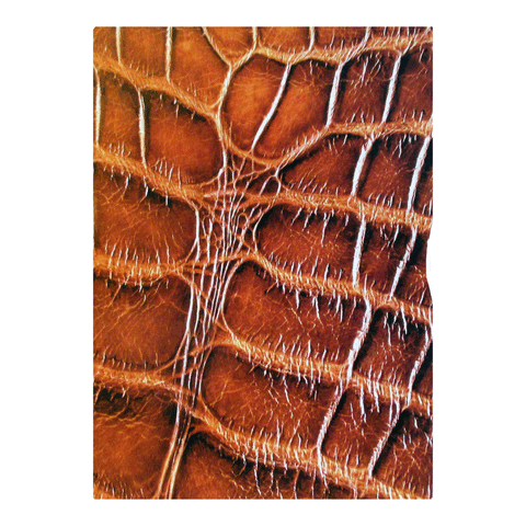 Close-up of textured brown leather, reptile-patterned with raised intersecting lines—Rogue Industries RFID Blocking Passport Sleeves feature PassportGuard technology for advanced RFID protection.