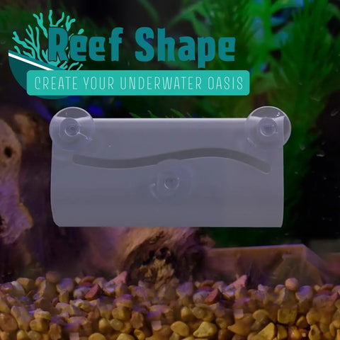 The Chatelet REEFSHAPE Betta Fish or Axolotl Amphibian Tunnel Hide by Chatelet Manufacturing, a white plastic aquarium accessory with three suction cups, attaches to glass above gravel and plants. “Reef Shape - Create Your Underwater Oasis.”.