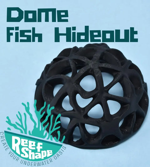 A black Chatelet REEFSHAPE Dome Hideout by Chatelet Manufacturing with an open lattice design sits on blue. Text reads “Dome Fish or Shrimp Aquarium Hideout” and a teal “ReefShape: Create Your Underwater Oasis” logo with coral graphics is shown.
