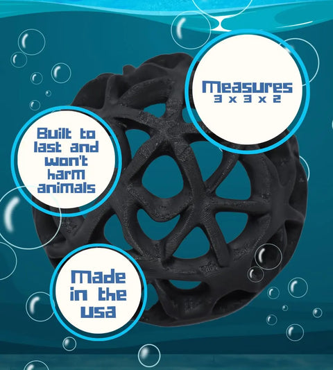 The Chatelet REEFSHAPE Dome Aquarium Hideout by Chatelet Manufacturing, shown underwater with bubbles, features a black geometric ball shape, measures 3x3x2 inches, is animal-safe, durable, and made in the USA.