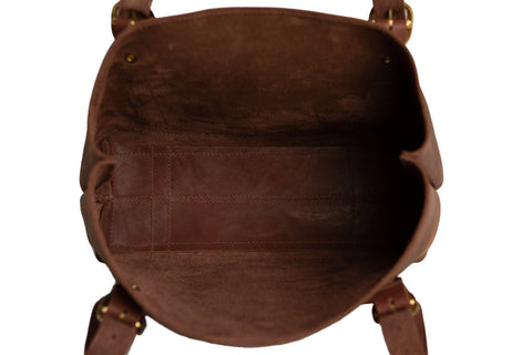 Top view of the empty Regina Tote by Urban Southern, highlighting its spacious interior and suede-like lining, with two side handles visible.