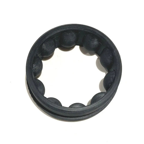 The Alpaca Mic Extra 55-60mm Ring is a black circular accessory with evenly spaced spheres along the inner edge, shown on a white background.