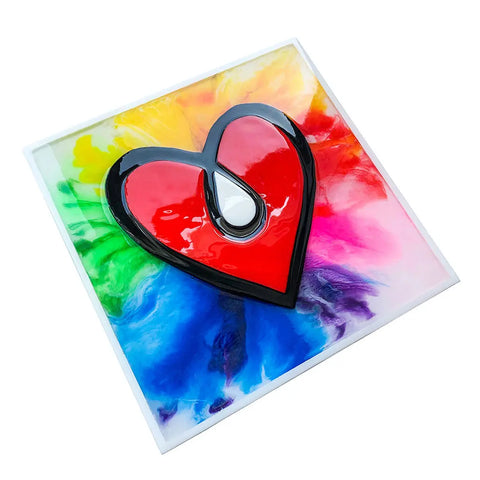 A glossy red heart with a black border and white highlight is centered on a square background featuring a vibrant rainbow swirl created using the ResinTint Complete Set BUNDLE - 16 Colors by ArtResin.