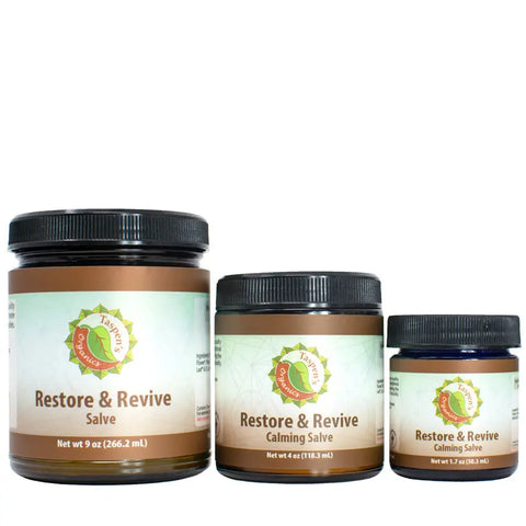 Three jars of Taspens Organics Restore & Revive Calming Salve in various sizes sit side by side, each with a beige and green label, green leaf logo, and black lid—an American-made skincare essential.