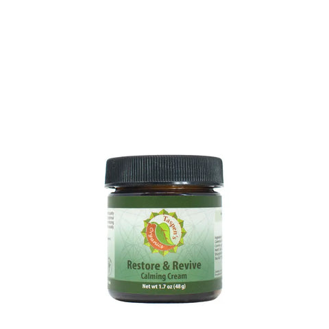 A 1.7 oz (48g) jar of Taspens Organics Restore & Revive Calming Cream—American-made skincare with a green label and black lid, featuring a gentle formula ideal for sensitive skin.