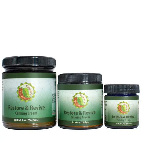 Three jars of Taspen’s Organics Restore & Revive Calming Cream for sensitive skin—9 oz, 4 oz, and 1.2 oz—each with green and white labels, are shown side by side on a white background. This American-made cream soothes and calms skin.