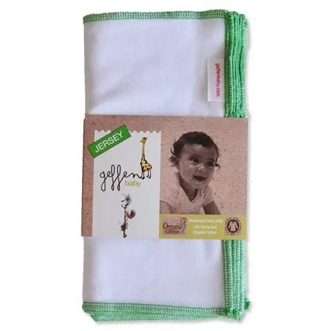 A folded white Geffenbaby Reusable Baby Wipes - Jersey with green trim in packaging showing a smiling baby and a giraffe. Made from organic cotton in the USA, these American-made wipes are soft and eco-friendly.