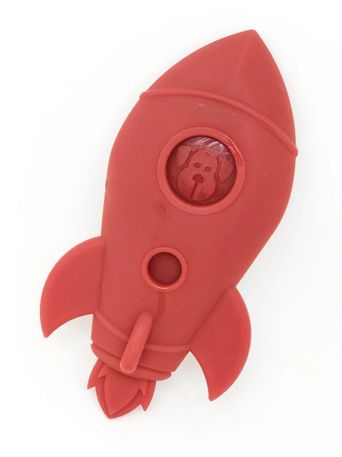The SodaPup Rocket Ship Ultra Durable Nylon Dog Chew Toy is red, rocket-shaped, and features a cartoon dog face in a circular window near the top.