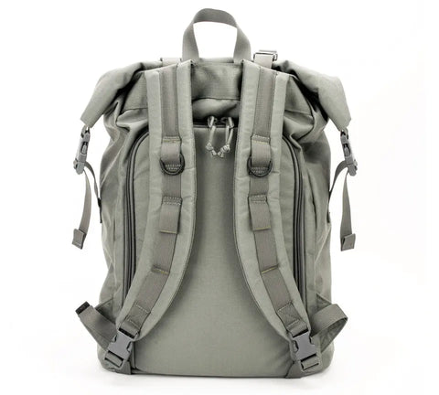 The MIS Roll Up Backpack - Foliage is displayed from the back, highlighting padded shoulder straps, a top carry handle, side buckles, and adjustable straps. Its durable, water-resistant build offers a minimalistic and functional design.