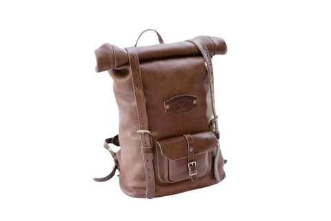 The Urban Southern Rolltop Backpack is a weather-resistant brown leather bag with a front pocket, buckle closures, and adjustable shoulder straps, shown against a white background.
