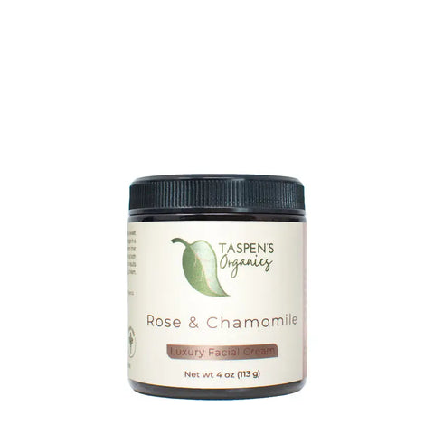Taspens Organics Rose & Chamomile Luxury Facial Cream, 4 oz (113 g), comes in a jar with a black lid and beige label featuring a green leaf logo. This organic moisturizer is ideal for sensitive skin care.