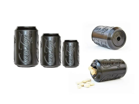 Four black SP Magnum Can Toy EDispenser Ultra Durable Rubber Chew Toys by SodaPup are shown. One is tipped over with treats spilling out, demonstrating its function as a treat dispenser; another shows the bottom opening.