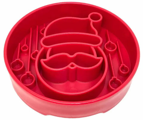 The SodaPup Santa Design EBowl is a red plastic enrichment slow feeder bowl for dogs, shaped like Santa’s face with a hat and mustache—perfect for festive mealtimes or fun holiday enrichment activities.