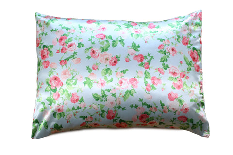 The Morning Glamour Satin Pillowcase Standard/Queen Single features a light blue background with pink and red roses, green leaves, and promotes smoother skin and healthier hair; eco-friendly packaging and multiple color options available.