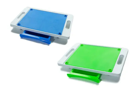 The Karving King Set of 2 Dripless Cutting Boards 2 in 1 System features blue and green rectangular boards with handles, sliding drawers, and a dripless carving system, shown set against a white background.