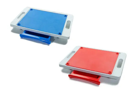 The Karving King Set of 2 Dripless Cutting Boards features a blue and a red board, each with handles and a matching pull-out tray in a 2-in-1 system for easy use.