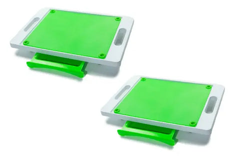 The Karving King Set of 2 Dripless Cutting Boards features green and white rectangular boards with handles and sliding green drawers for a 2-in-1 dripless carving system, shown on a white background.