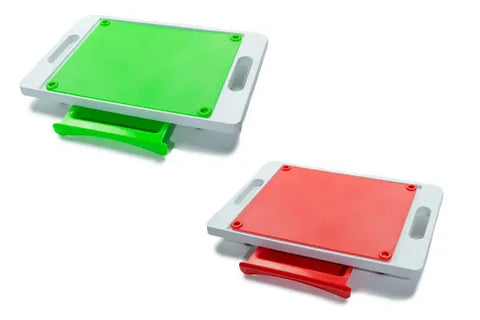 The Karving King Set of 2 Dripless Cutting Boards 2 in 1 System includes a large green board for meat and a smaller red board, both with handles and sliding trays to collect chopped items, featuring a convenient dripless carving system.