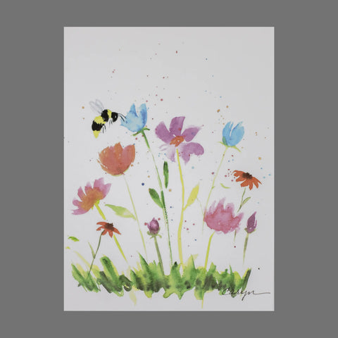 The JuLu Cards Pack of 4 - Flowers With a Bee (20066) features watercolor wildflowers and green grass with a bumblebee above, set on a white background. Flecks of paint add a lively, whimsical touch—ideal for cards or envelopes.