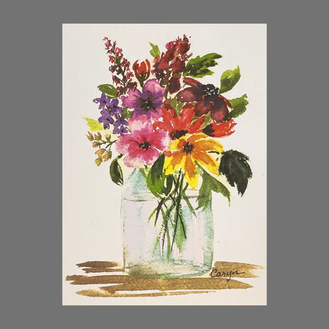 The JuLu Cards Pack of 4 - Flower Arrangement in Clear Vase (20054) features watercolor cards with a vibrant floral bouquet in a glass vase on a white background, signed Caryn. Includes four cards with matching envelopes.