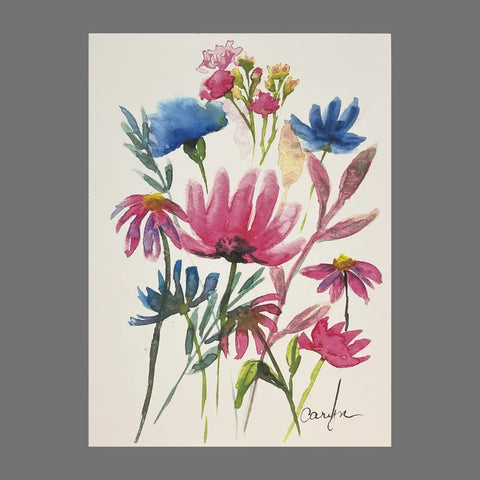 This Pack of 4 - Pink and Blue Flowers (20051) by JuLu Cards features vibrant watercolor wildflowers with green stems on a white background, ideal for greeting cards. The artist’s signature is at the bottom right.