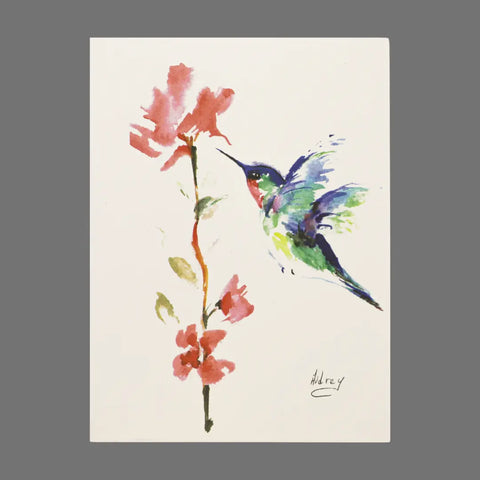 JuLu Cards’ Pack of 4 - Hummingbird at Pink Flowers (20008) features watercolor art of a vibrant hummingbird near pink flowers and green leaves on a white background, signed by Audrey. Ideal for card-size prints or greeting cards with envelopes.