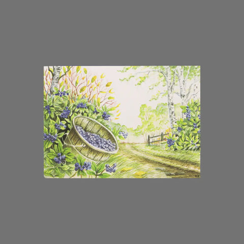 A pack of 8 greeting cards from JuLu Cards, featuring a wooden bucket of blueberries among lush shrubs and purple flowers, with trees and a wooden fence under a bright sky. Product: Blueberry Shrubs and Bucket (10011).