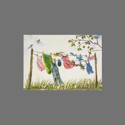 The Pack of 8 - Clothes on a Clothesline (10079) by JuLu Cards features watercolor art of colorful clothes on a line outdoors, birds nearby, wildflowers below, and a leafy branch. Includes eight cards with envelopes.