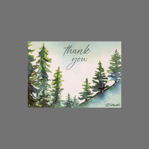 Send warm wishes with JuLu Cards’ Pack of 8 Thank You With Forest Trees (10101), featuring watercolor evergreens and cursive text on a blue-green background—perfect for expressing your gratitude.