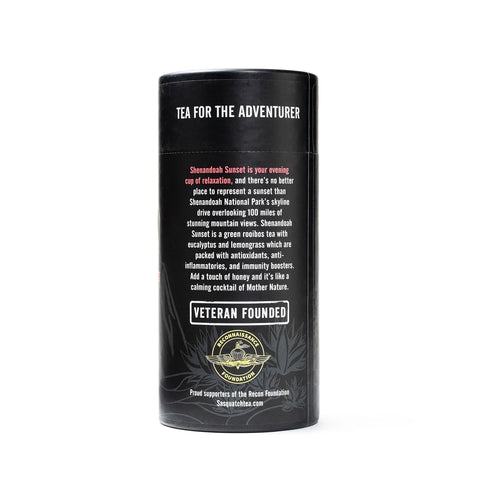 A black cylindrical tea container labeled Tea for the Adventurer features Sasquatch Tea Co’s Shenandoah Sunset, a caffeine-free, antioxidant-rich green rooibos blend with honey that supports the Recon Foundation.