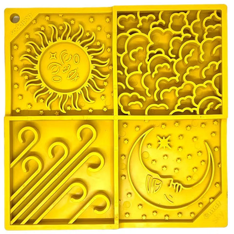 The SodaPup Sky Design EMat Enrichment Lick Mat, in yellow silicone, features four sections with sun, clouds, wind, and moon designs—ideal for supporting your dog’s digestive health and promoting calm.