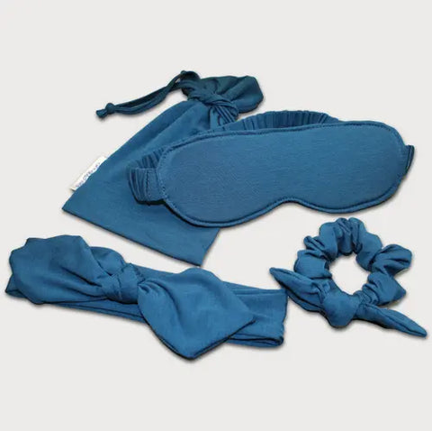 The Goodnighties Accessories Value Pack features matching blue sleepwear essentials—a sleep mask, drawstring pouch, scrunchie, and bow headband—beautifully displayed on a white background.
