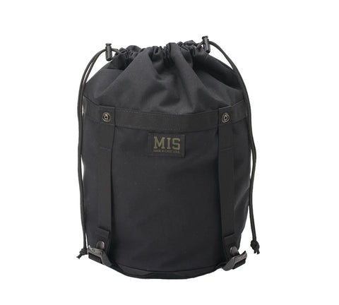The MIS Compression Stuff Sack Small in black is a water-resistant 9L bag made from durable Cordura Nylon, featuring side straps, a top closure, and a rectangular MIS patch on the front.