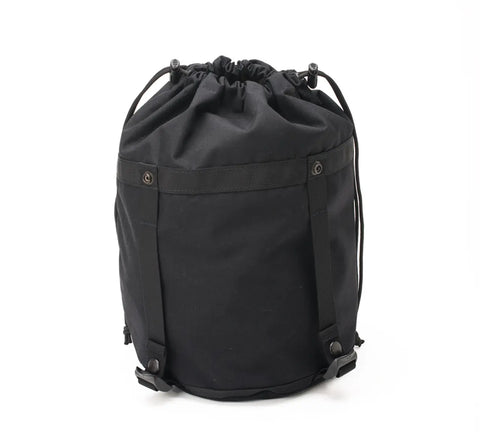 The MIS Compression Stuff Sack Small - Black is a cylindrical, 9L water-resistant Codura Nylon backpack with two adjustable shoulder straps and front button details, shown against a white background.