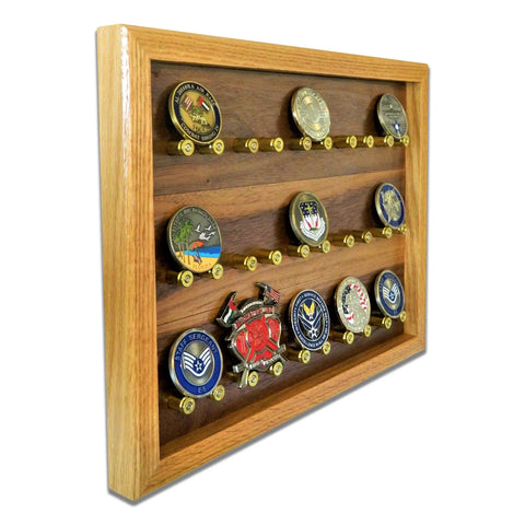 The ORIGINAL Brass Casing Challenge Coin Display - Small by Legacies of America Woodworking Company features three angled hardwood shelves to proudly showcase multiple military challenge coins and their colorful insignias.