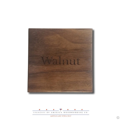 A square wooden sample labeled Walnut is centered on a white background. Below it, the Legacies of America Woodworking Company logo features blue stars and text, highlighting The ORIGINAL Brass Casing Challenge Coin Display - Small, American Made and Veteran Built.