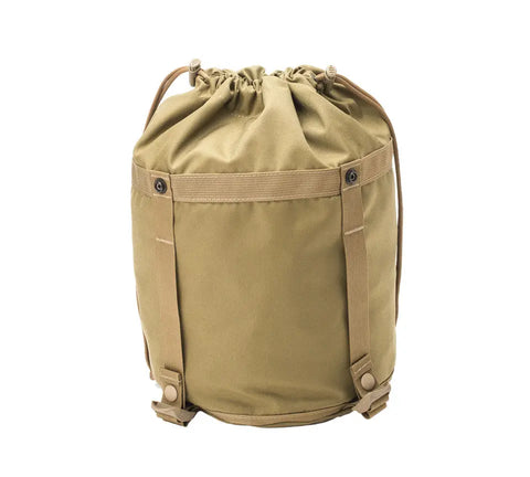 The MIS Compression Stuff Sack Small in coyote tan is a water-resistant canvas duffel bag with a drawstring top, two vertical straps, and reinforced stitching, shown upright against a white background.