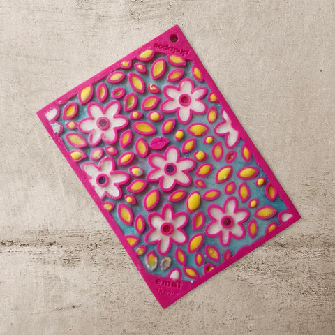 The SodaPup Small Pink Flower Power & Small Yellow Honeycomb EMat Lick Mat Bundle features a floral pink-edge mat, ideal for dog enrichment and supporting dental health.