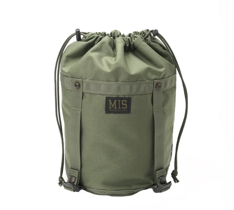 The MIS Compression Stuff Sack Small in camo green, featuring a black front label, drawstring closure, two side buckle straps, and a durable minimalist design, is shown against a white background.