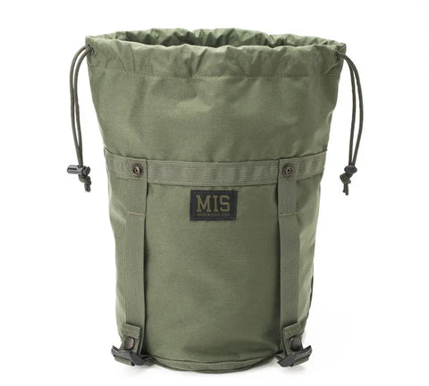 The MIS Compression Stuff Sack Small in Camo Green is a water-resistant Codura Nylon utility bag with drawstring closure, black bottom clips, two vertical straps, and a MIS Made in USA patch on the front. The bag stands upright against a white background.