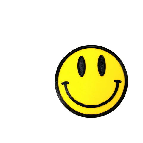 The FRESHe BOGLETS Smiley Emoji Charm by Chatelet Manufacturing features a yellow smiley face with black eyes and a curved smile, perfect for Bogg Bags, Simply Southern, and other totes. Centered on a white background with space on the left.