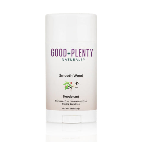 A white stick of Good + Plenty Naturals™ Smooth Wood - Sensitive | Aluminum-Free Natural Deodorant, with a leaf and wood graphic, labeled for sensitive skin—paraben free, aluminum free, and baking soda free.