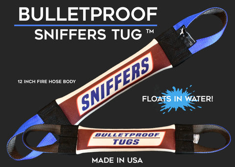 Two durable Sniffers Fire Hose Training Tug - Candy Series toys from Bulletproof Pet Products Inc feature blue and black handles, “FLOATS IN WATER!” text, and “MADE IN USA” at the bottom—premium fire hose dog toys on a sleek black background.